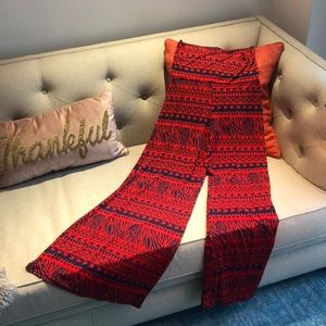 Animal and tribal print red, wide legged pants.
